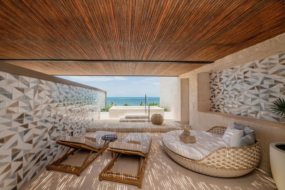 Outdoor pool area at Atelier Playa Mujeres resort